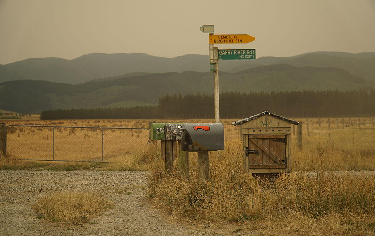 Smokey haze over a rural Canterbury landscape