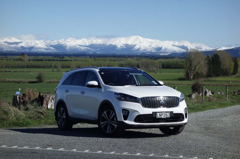 The 2018 Kia Sorento Premium in white in front of mountains