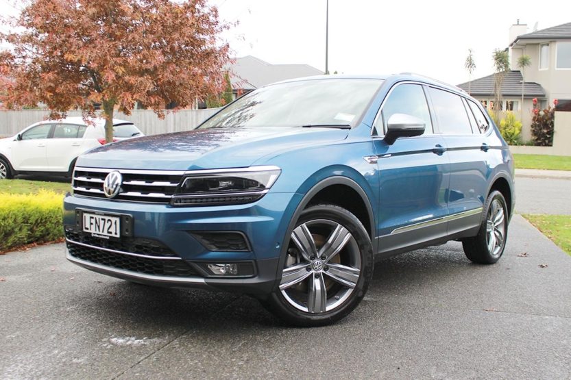 Volkswagen Tiguan Allspace in Blue Silk parked on a driveway